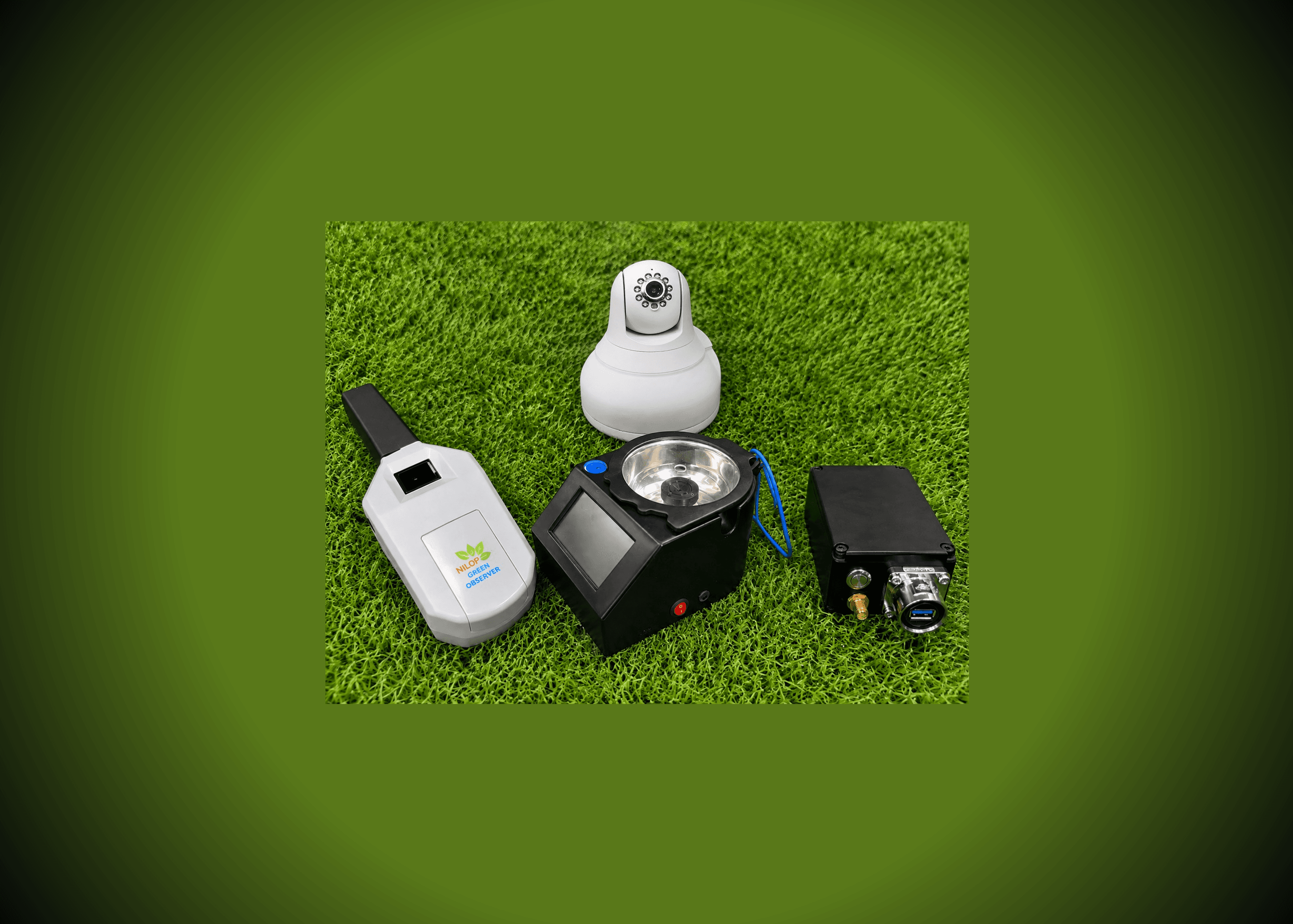 Four fully assembled hardware products - a handheld sensor, a PTZ camera, a touchscreen sample-analysis device, and a rugged connector enclosure - laid out together