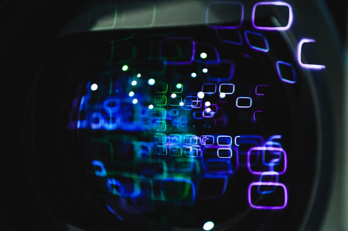 Close-up of a camera lens reflecting glowing digital data overlays