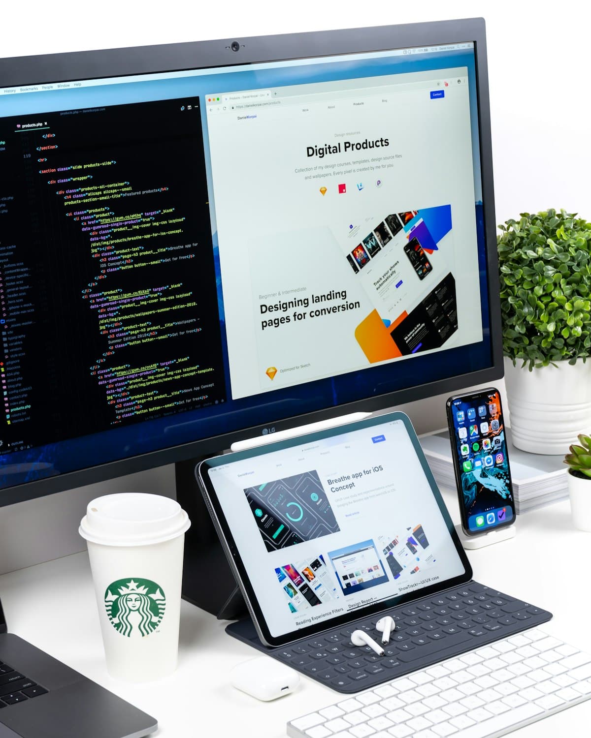 A desktop monitor, tablet, and phone displaying a web design portfolio and code